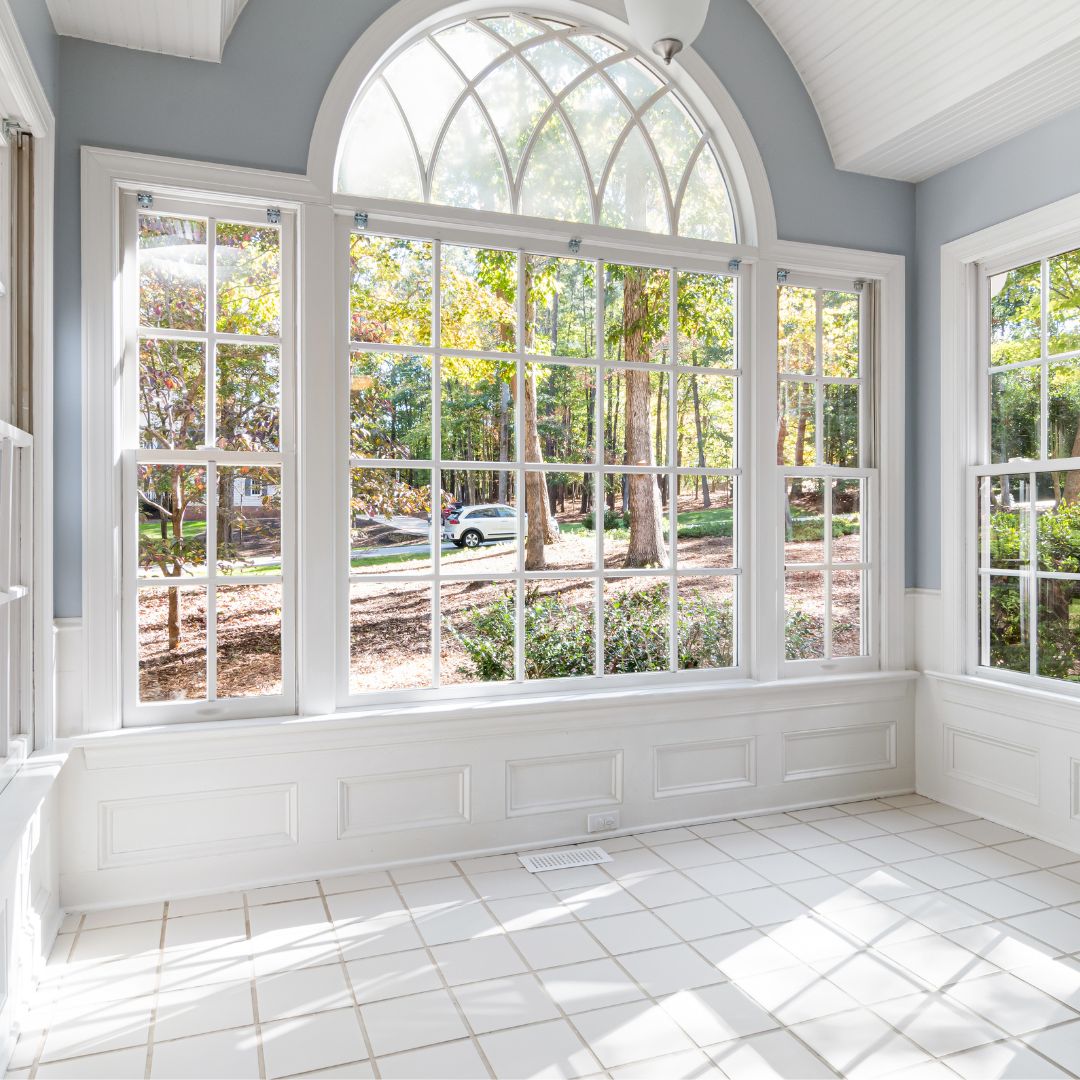 White sunroom with big windows